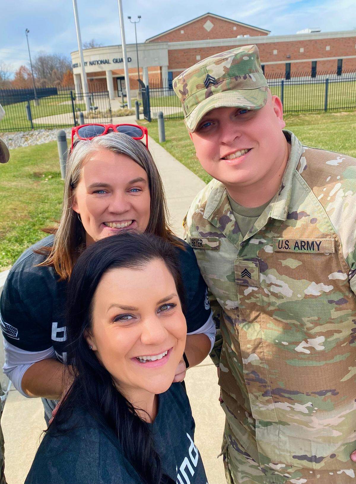 As the regional ambassador for Giving Tuesday Military, Alicia Steele of O’Fallon is excited this year’s Deck the Halls event plans to be even bigger than the inaugural one last year. Pictured from last year are Steele (back center) and fellow volunteer Jessica Manfre with an assist from a soldier.