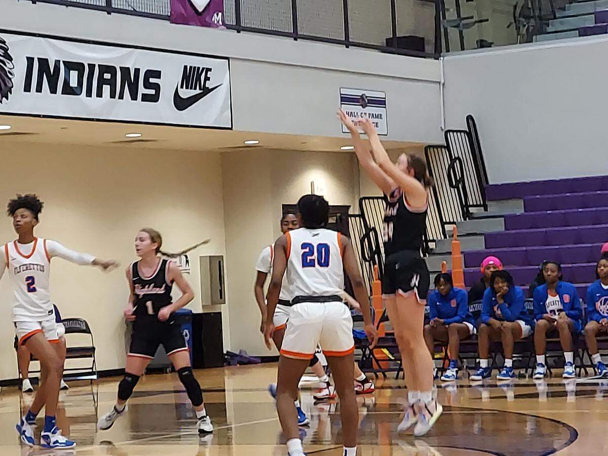 Highland junior post Larissa Taylor rises for a jumper over the East St. Louis defense during the first half of the Mascoutah Invitational Tournament on Thursday, Dec. 29. The Lady Bulldogs ultimately posted a 56-42 win to capture the consolation championship.