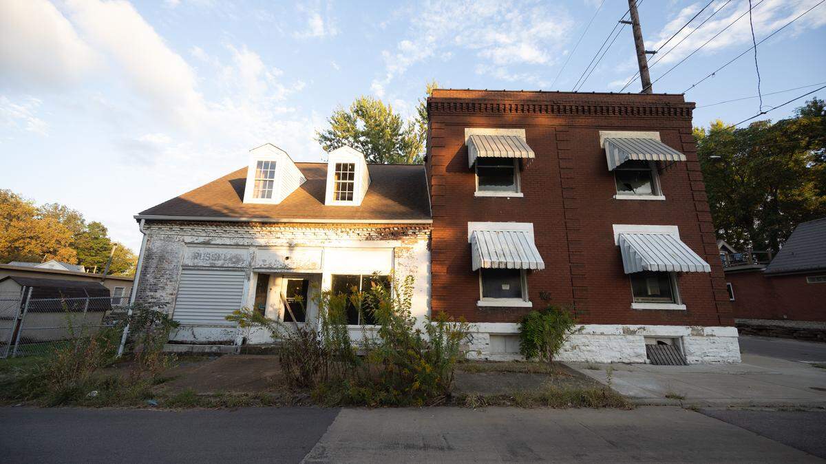 This property at 102 N. 11th St. in Belleville is actually two structures, including a German American folk house (painted white) that was used for businesses and a prairie foursquare home.