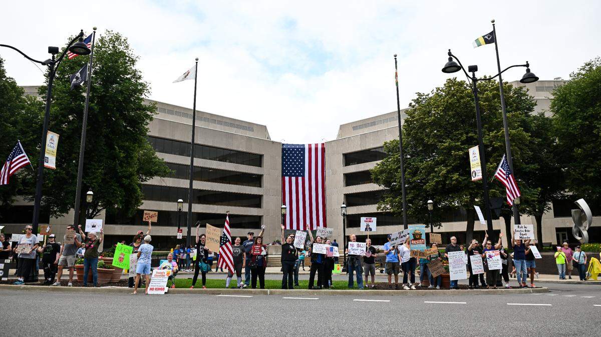 Protesters rally against President Donald Trump at the “No Kings” protest in Belleville’s Public Square Saturday, June 14, 2025.