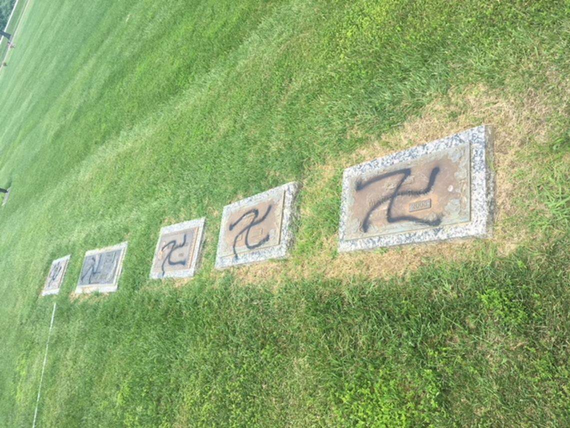 Some of the vandalized grave markers at Sunset Hill Cemetery.