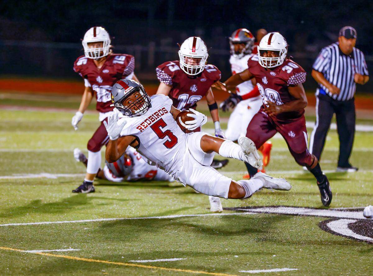 Alton’s Byron Stampley Jr. is in action against Belleville West during a Southwestern Conference game Friday, Sept. 16. The Maroons ultimately dropped a 28-7 verdict.