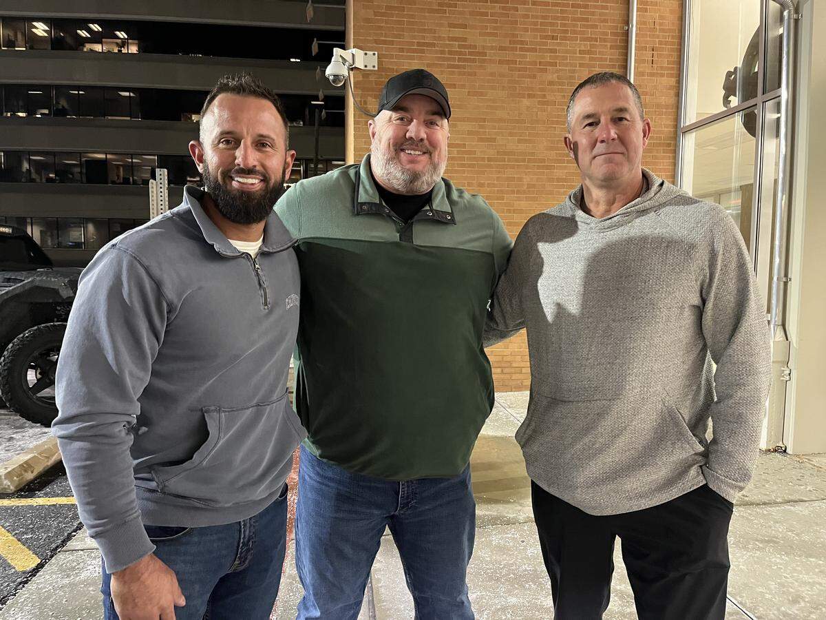 Three brothers-in-law, who co-own the Illinois Recovery Center in Swansea, are shown outside Belleville City Hall on Monday night. They are, left to right, Eric Conley, Brian Wellen and Steve Campo.