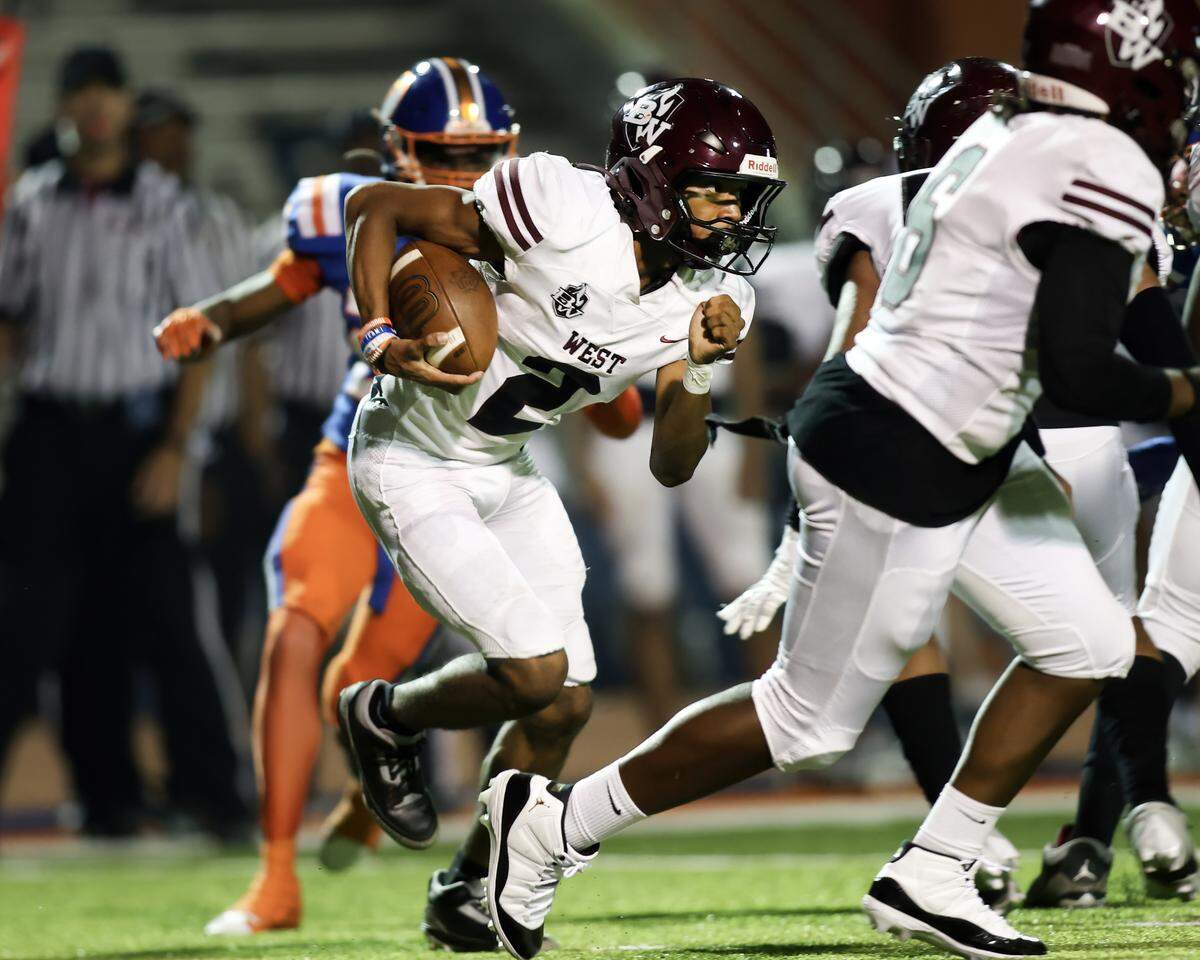 October 4, 2024 - East St. Louis Il, - Belleville WestÕs Troy McLean runs for a touchdown during the first half of Friday night’s Southwestern Conference matchup between Belleville West and East St. Louis. [Photo: Chris Johns]