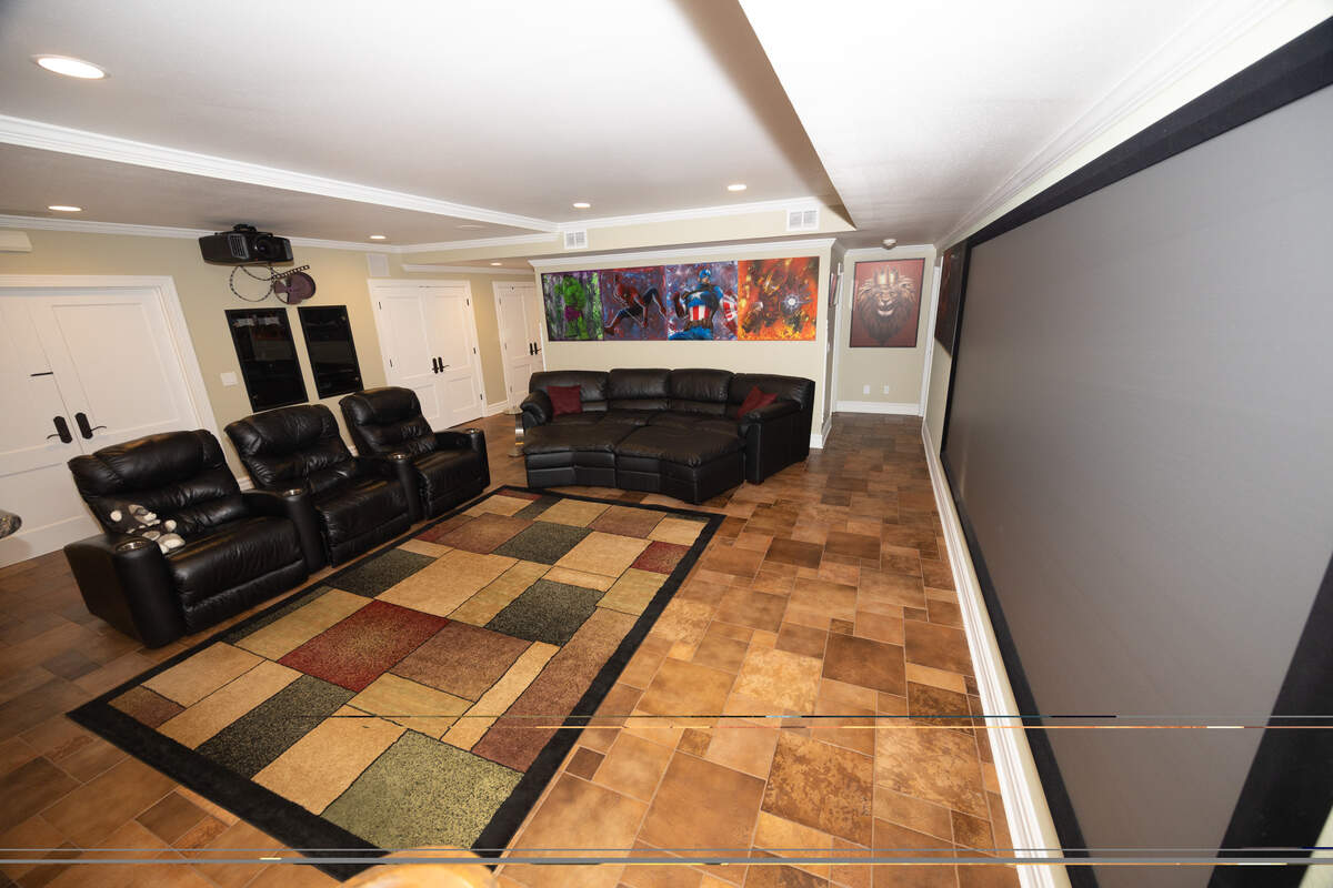 Upon entering the basement, one is greeted to a state-of-the-art home theater.