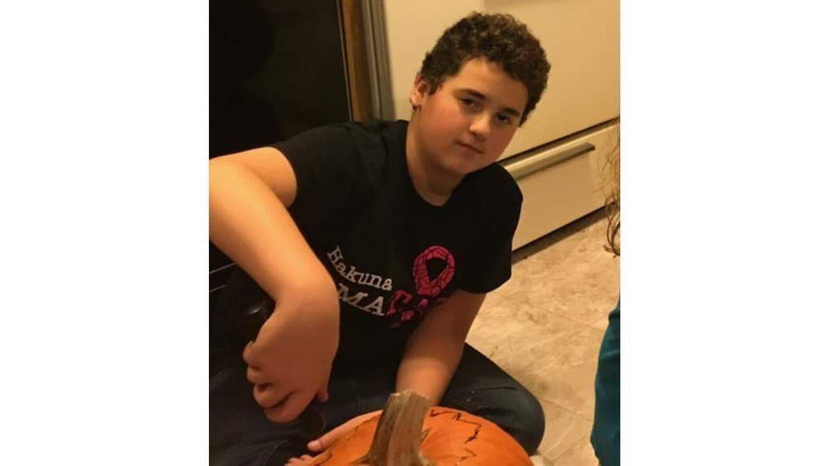 Twelve-year-old Blake Coil was told to cover this cancer awareness shirt at a Belleville, Illinois, school, which his mom said he was wearing to honor his grandma’s fight with breast cancer.