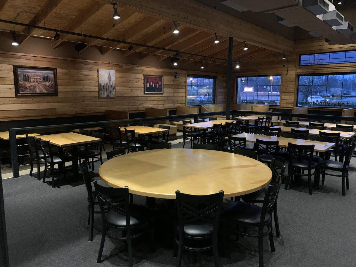 All shapes and sizes of tables await customers in the restaurant at Signature Tap House, which is expected to open Feb. 1 near St. Clair Square in Fairview Heights.