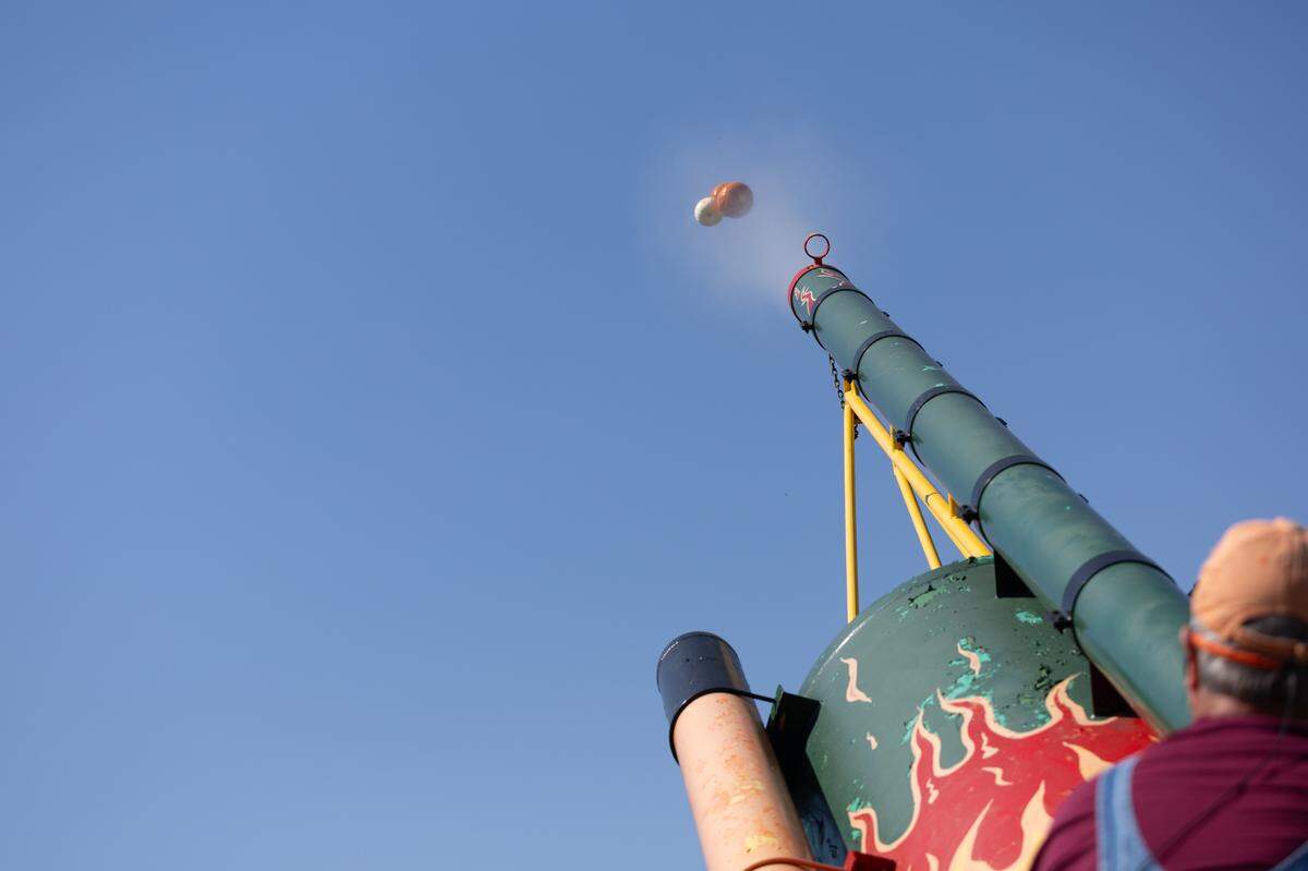 ‘Rusty Pliers’ has operated Eckert’s pneumatic pumpkin cannon for years and hosts hourly shows in which he fires pumpkins hundreds of yards with great enthusiasm at their Milstadt Fun Farm.