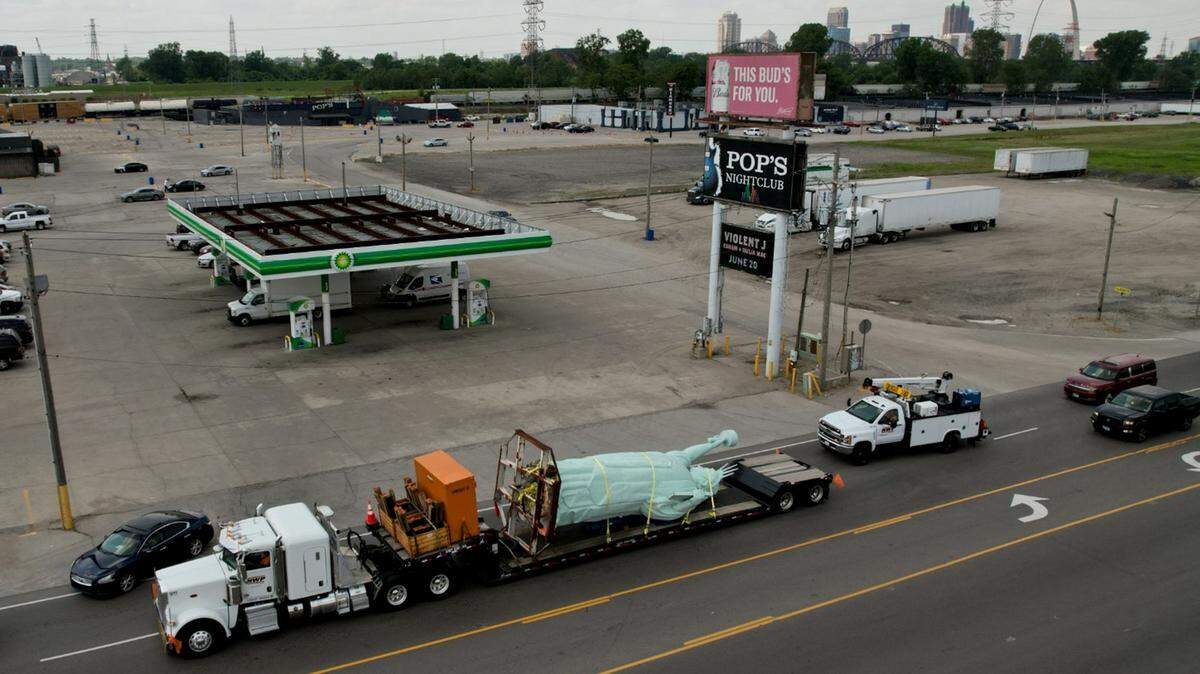 A roughly 30-foot, 8,500-pound, replica of the Statue of Liberty is delivered on Thursday, May 18, 2023, at the National Building Arts Center in Sauget. The statue was donated to the art center that specializes in preserving building materials and literature by a museum in Brooklyn, N.Y.