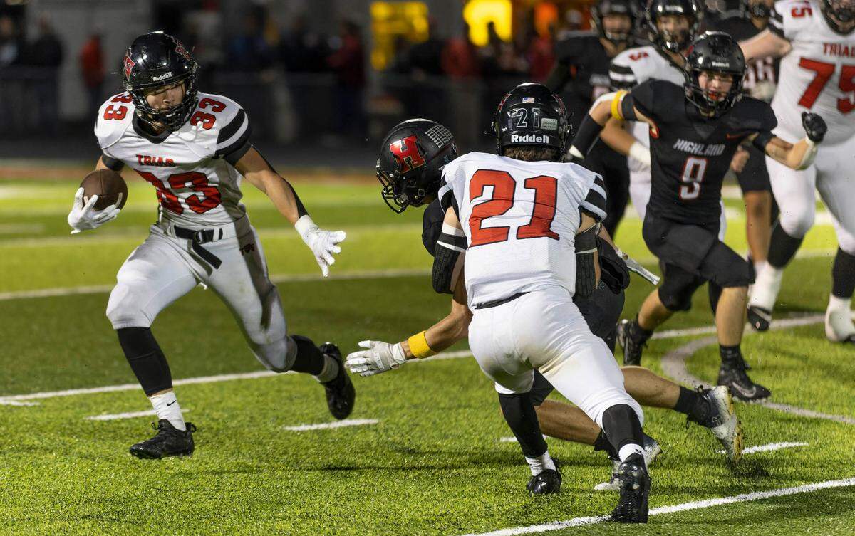 Triad’s Colin Qualls runs the ball during Friday night’s Mississippi Valley Conference game against Highland. The Knights ultimately dropped a 35-0 decision.