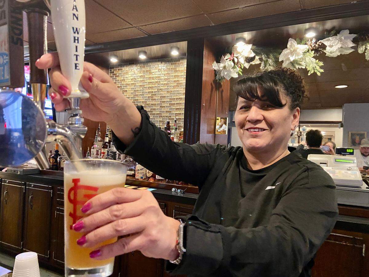 Volunteers and staff at the O’Fallon Knights of Columbus Hall are gearing up for the biggest fish fry in town this Lenten season, and have extended Friday dinner service to 8 p.m. Mona Manzano, the hall events coordinator, tends bar for the fish fry.