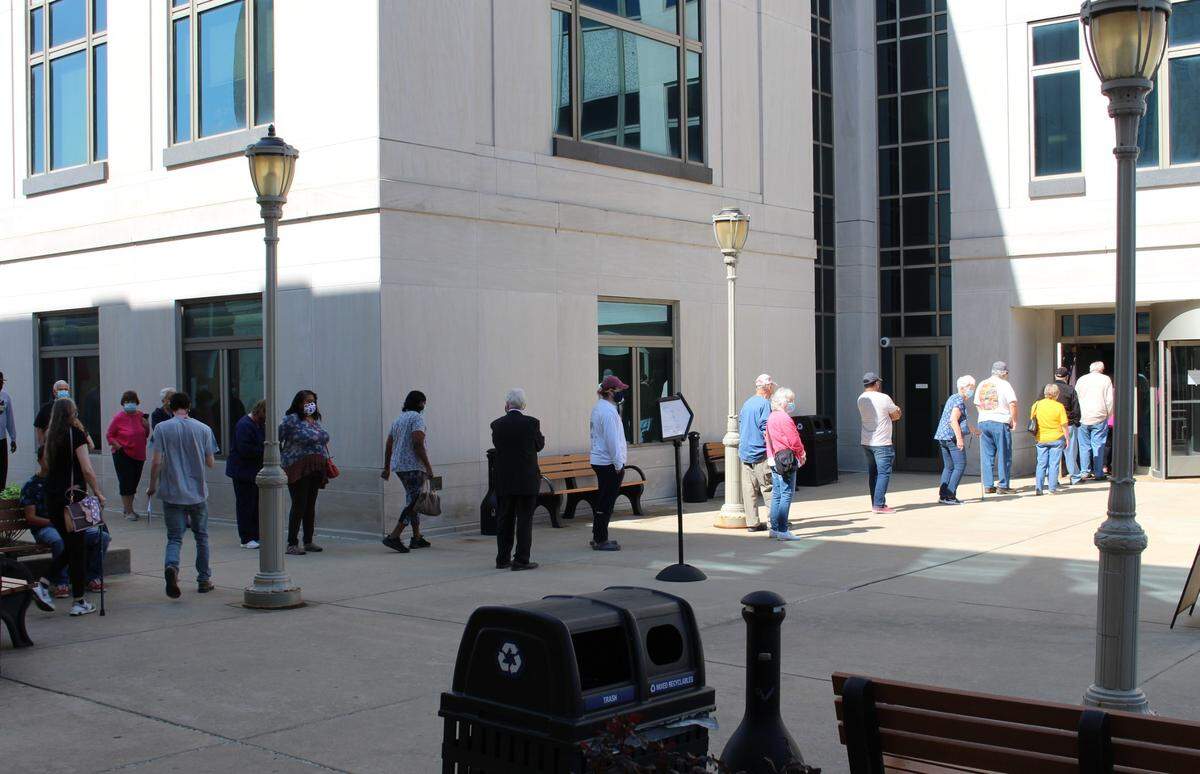 Voters line up to cast ballots early outside the Madison County Administration Building in Edwardsville on Sept. 24.