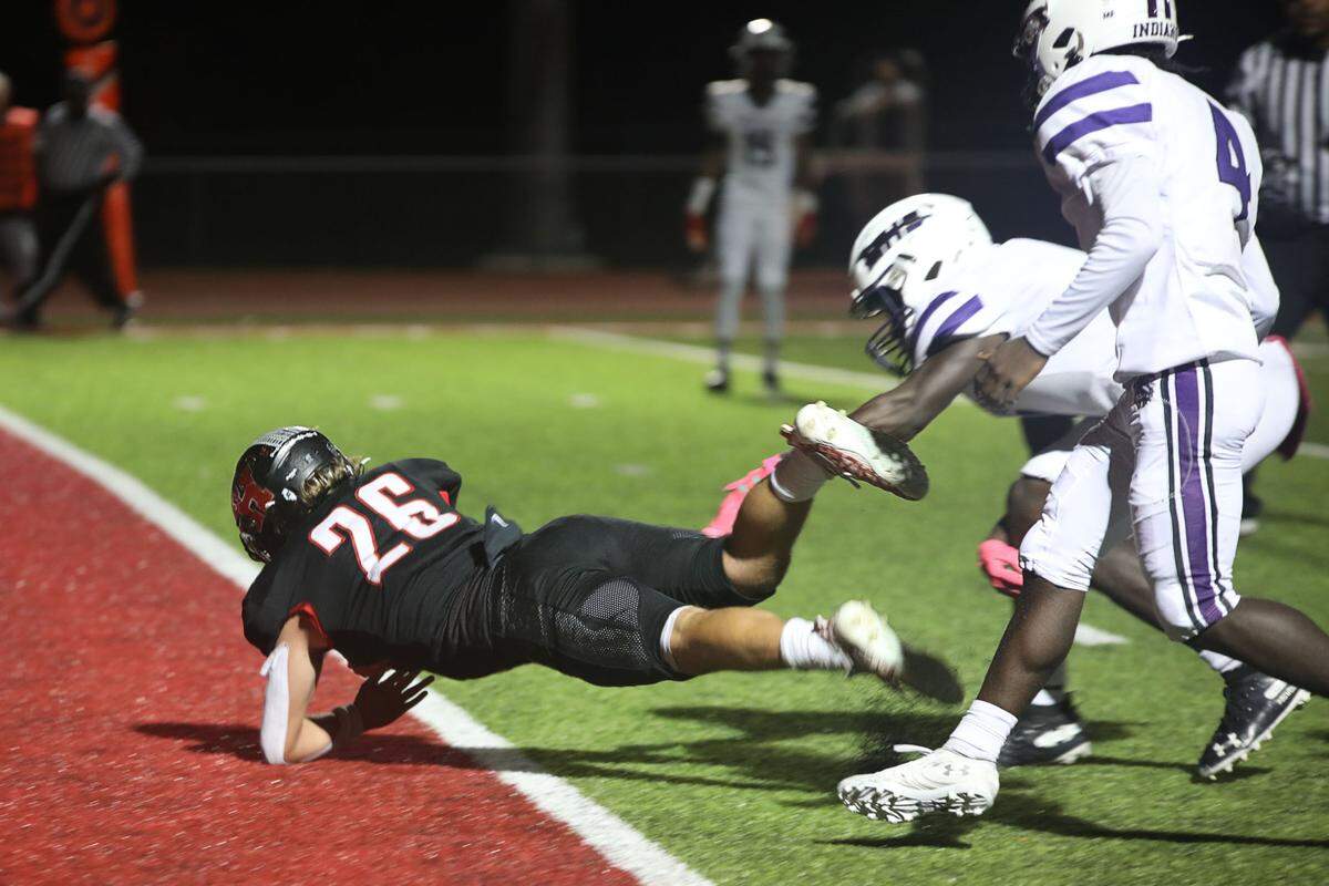 Highland’s Travis Porter leaps to score a touchdown during a Mississippi Valley Conference game against Mascoutah earlier this season. The Bulldogs opened the playoffs Friday night with a home game against Dunlap.