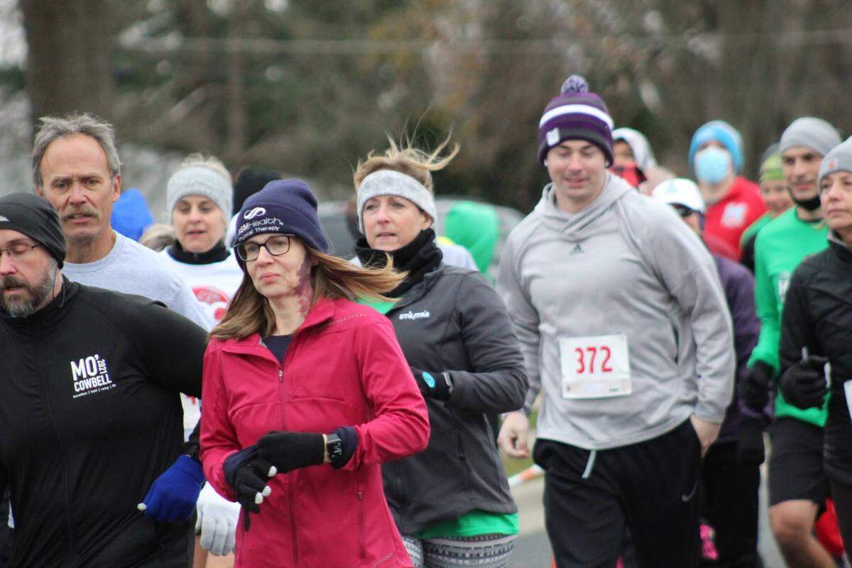Runners participates in the annual Holiday Hilltop 5K Run/Walk in Shiloh. Event Director Neil Jansen said over $280,000 has been raised during the past 10 years to benefit a young person battling a challenging medical condition.