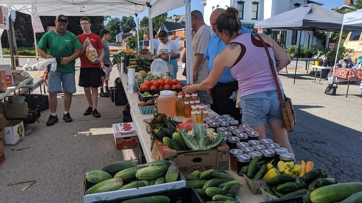 Bryan Lehr, in green T-shirt, is the new manager of Old Town Market in downtown Belleville, shown in this 2019 file photo. His father, Art Lehr, owns Lehr’s Vegetable Farm in rural Columbia.