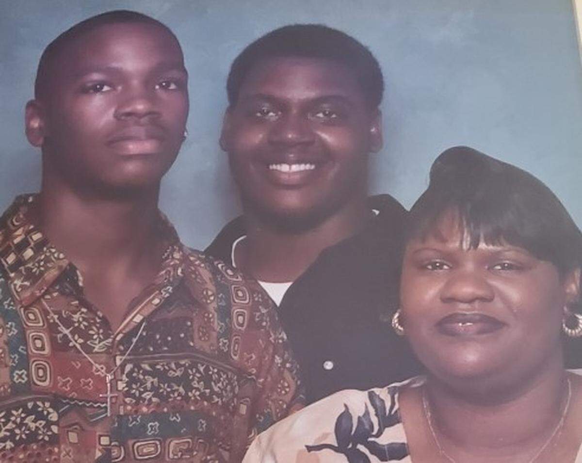 Antonio Bryant, center, is shown with his brother, Ja’Mel Bryant, and mother, Cecilia Eiland, when the boys were in high school. Ja’Mel was killed in Iraq 11 years ago.