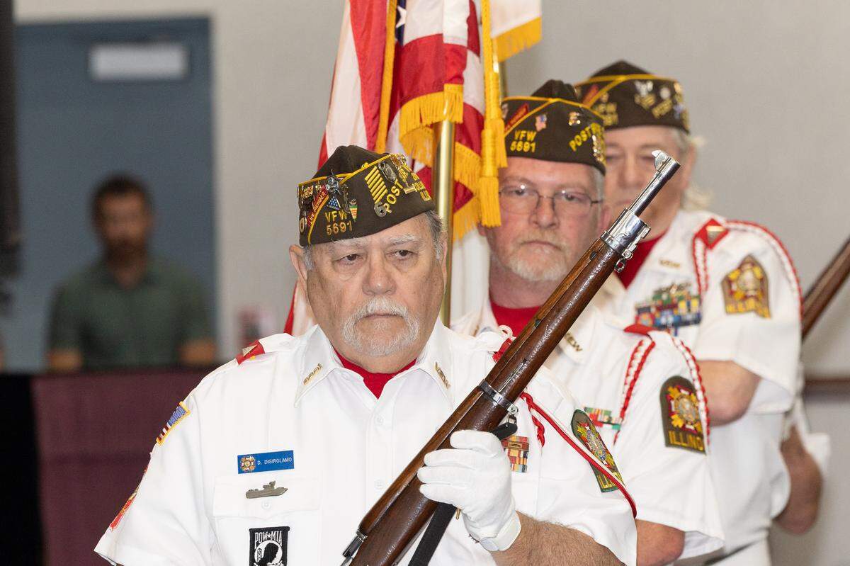 Members of VFW Post 5691 present the American Flag prior to a naturalization ceremony in Collinsville.