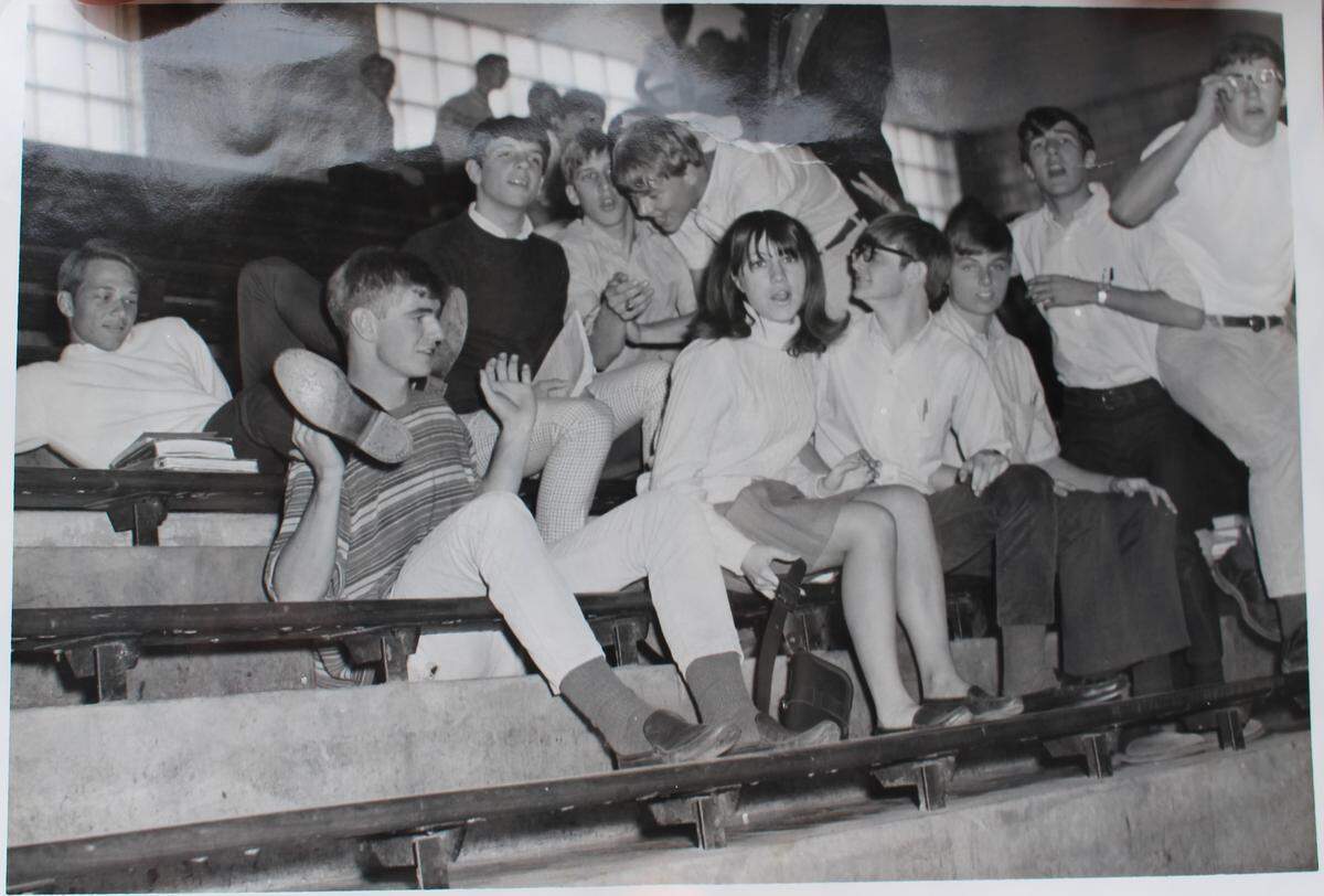 John “Bubby” Hinkle props his feet on the shoulders of Mike Morrison, who is sitting next to his girlfriend, Debbie Means, at Mascoutah High School in this 1960s photo.
