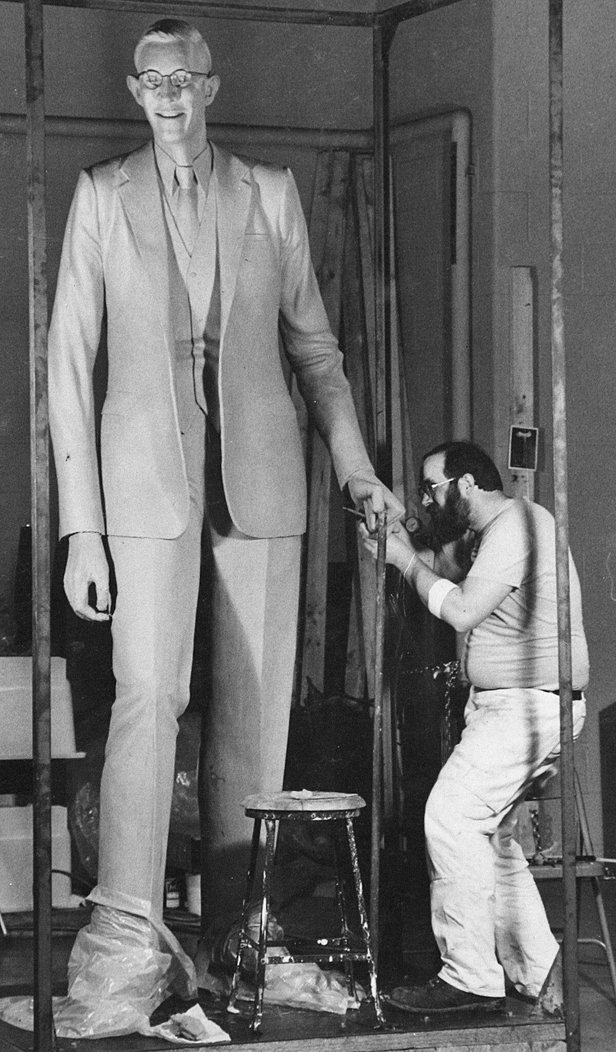 Ned Giberson sculpting his piece on Robert Wadlow in 1984.