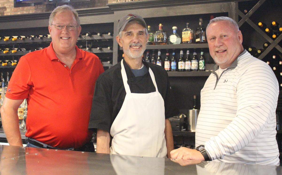 Tony Mazzola, center, owner of the new Mungo’s Uptown Italian restaurant, poses with Bud Jacob, left, and his brother, Scott. The Jacobses own the building in downtown Collinsville with partner Gregg Crawford.