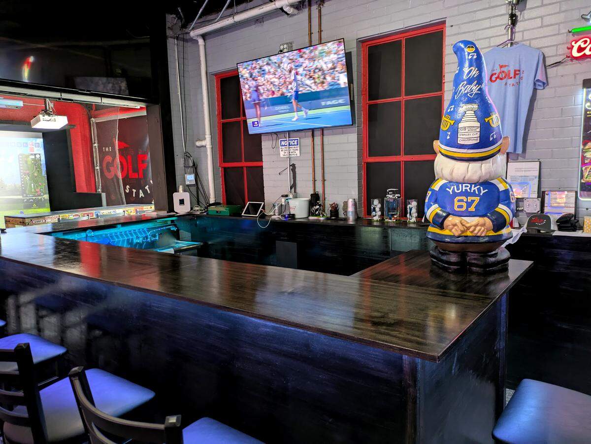 The windows behind the bar at The Golf Station are original to the building.