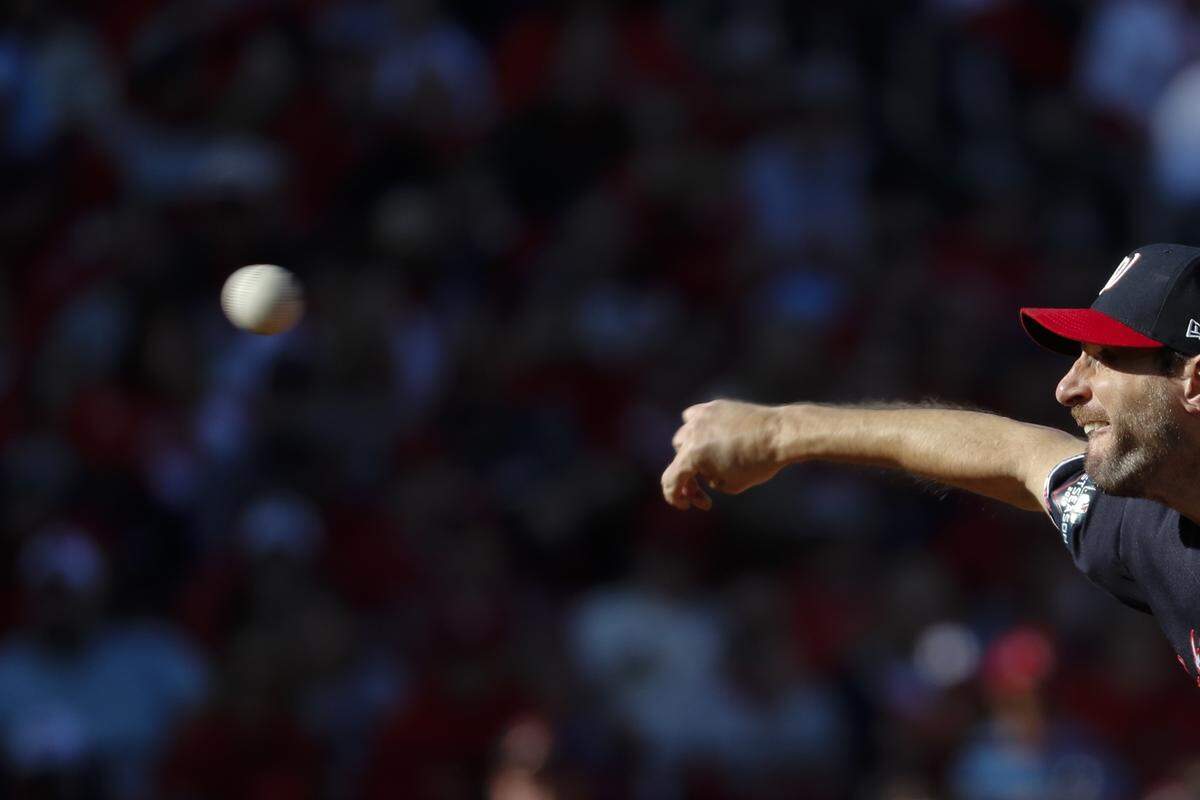 Washington Nationals starting pitcher Max Scherzer throws during the first inning of Game 2 of the baseball National League Championship Series against the St. Louis Cardinals Saturday, Oct. 12, 2019, in St. Louis. (AP Photo/Jeff Roberson)