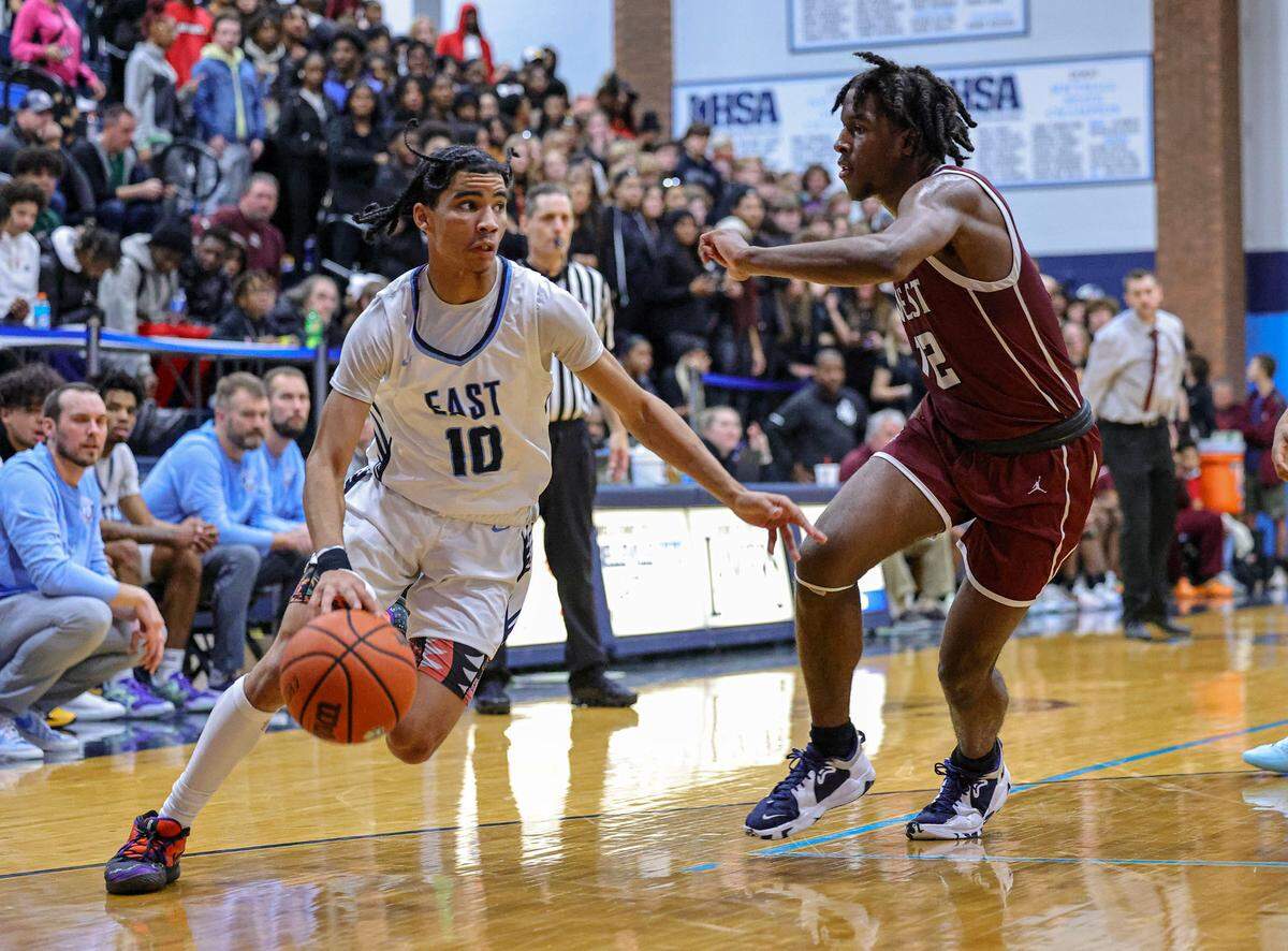 November 6, 2023 - Belleville, IL - Belleville East Mason Mosley drives the base line during the Belleville East vs Belleville West varsity basketball game. [Photo: Jimmy Simmons]