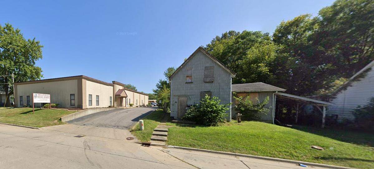 Belleville School District 118 bought the boarded-up, two-story home at 1326 E. Main St., right, from the limited-liability company Topstone Inv CAH 1 two years ago and demolished it. At left is the district’s Head Start center.