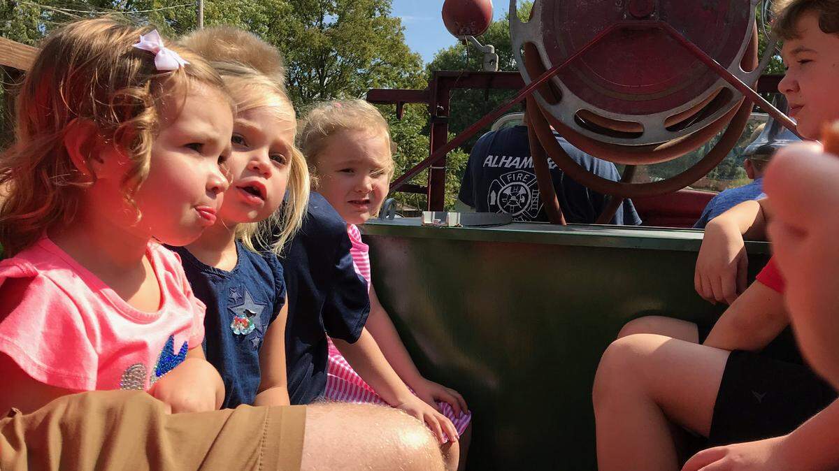 Kids love riding on the antique fire truck at the open house hosted by Alhambra Fire Department.