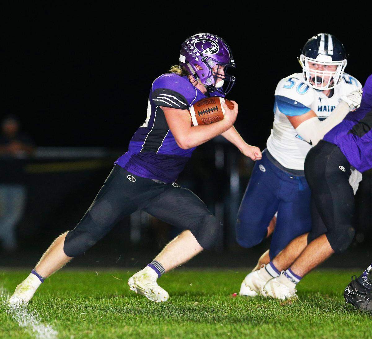 Central’s Jordan Spangenberg carries the ball for a touchdown against Mater Dei in the annual Milk Bowl game Friday night in Breese.