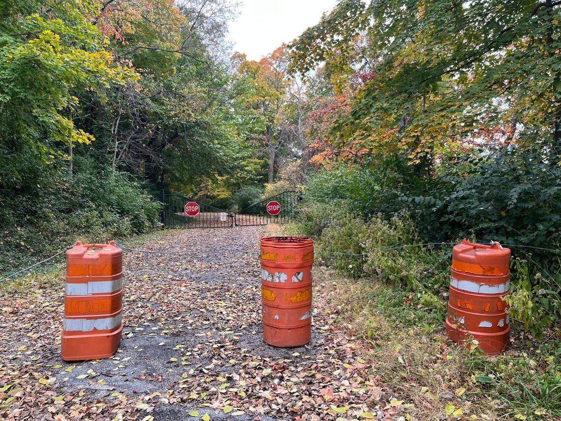 A locked steel gate and orange barrels keep traffic from going south on Bluff Hill Road from Illinois 157 in unicorporated Belleville most of the year. It’s left open in winter months to accommodate snow plows.
