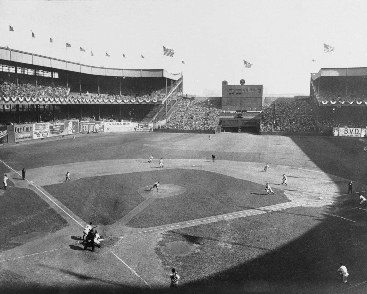In this Oct. 4, 1933 file photo, New York Giant’s Travis Jackson bunts against Washington Senators pitcher General Crowder during the second inning of Game 2 of baseball’s World Series at the Polo Grounds in New York. In clinching a playoff spot, the Washington Nationals put the nation’s capital in baseball’s postseason for the first time in nearly 80 years. (AP Photo/File)