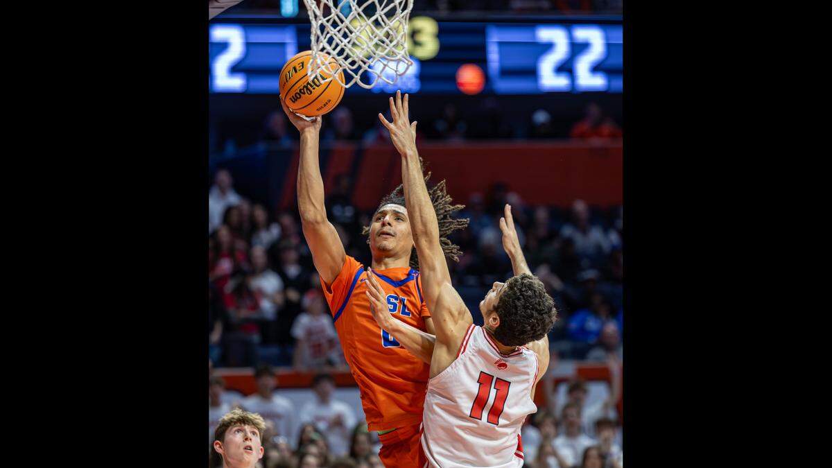 Jamison White goes to the rim for a score against Deerfield in the championship game of the IHSA Class 3 State Tournament in Champaign Saturday.