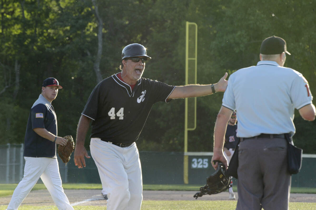Highland manager Harry Painter argues with the home plate umpire over what he thought was a premature granting of timeout in Post 439’s game on Wednesday at Alton.