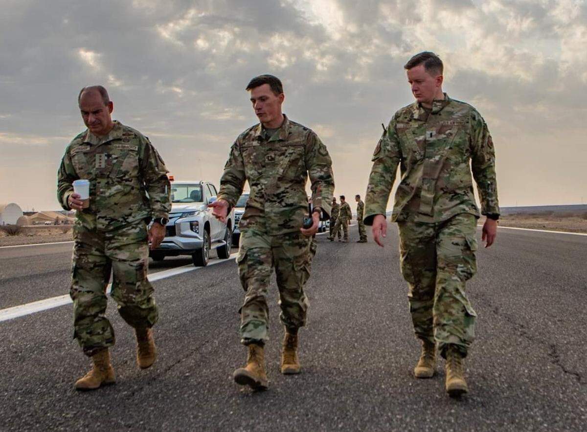 First Lt. Kiefer Luth, right, along with Capt. Zach Diehl, center, escorts General Jeffrey Harrigian, left, U.S. Air Force Europe and Air Forces Africa commander, on an inspection of the the Chabelley Airfield, Djibouti runway.