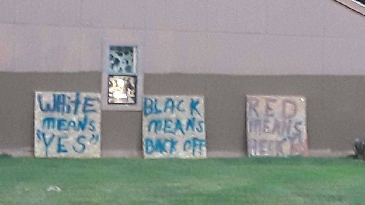 Signs outside the house in O’Fallon.