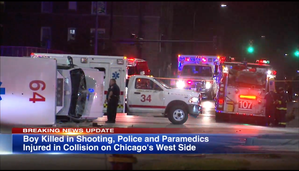 An ambulance in Chicago ended up on its side after it was slammed into by a police cruiser while both were en route to a shooting, police say.