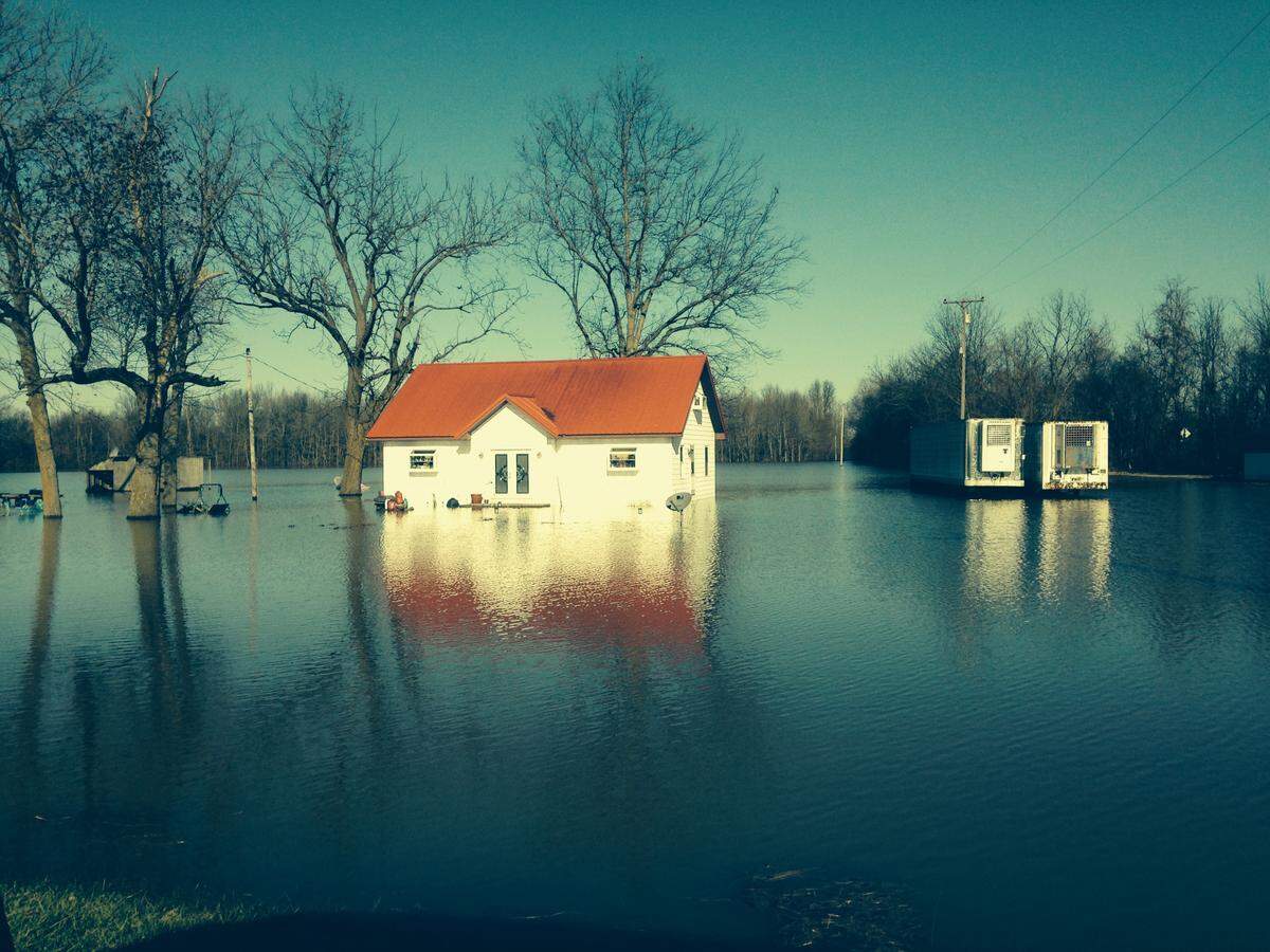 A house in Tamms that belonged to Brandy Renshaw’s uncle takes on floodwater in 2019.