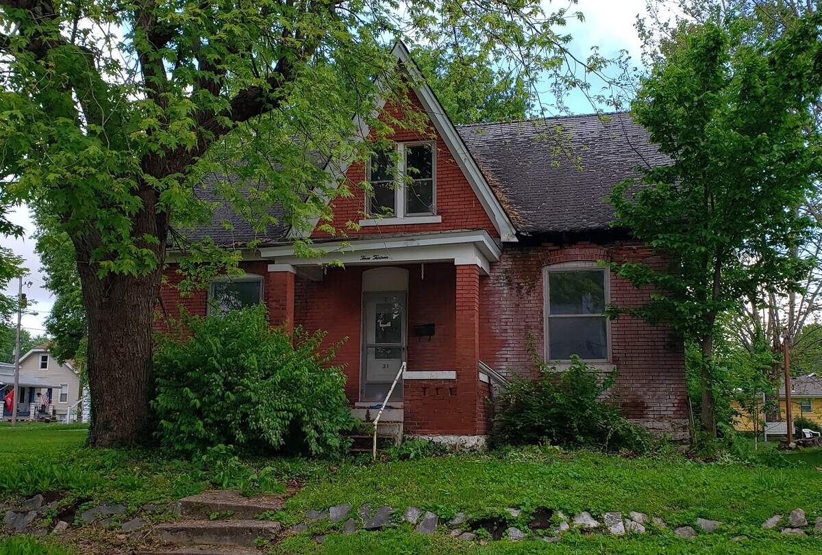 This photo shows the 1905 brick home at 313 S. Ninth St. in Belleville before it was renovated by Belleville Community Development Corp.