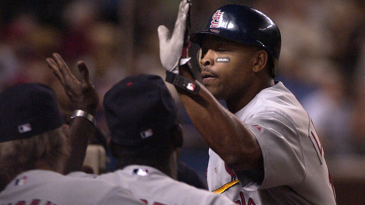 St. Louis Cardinals' Ray Lankford is congratulated after hitting a solo home run in the third inning against the Arizona Diamondbacks Saturday, April 10, 2004 in Phoenix.