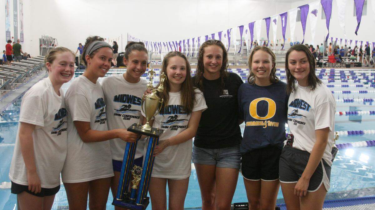 Some members of the Breakers girls team celebrating after their Midwest Conference Meet Championship effort. From left are Shelby Bushong, Alexis Schillinger, Madison Doehring, Gabby Miller, Sophia Tamblyn, Kylie Clark, and Sophia McCloud.