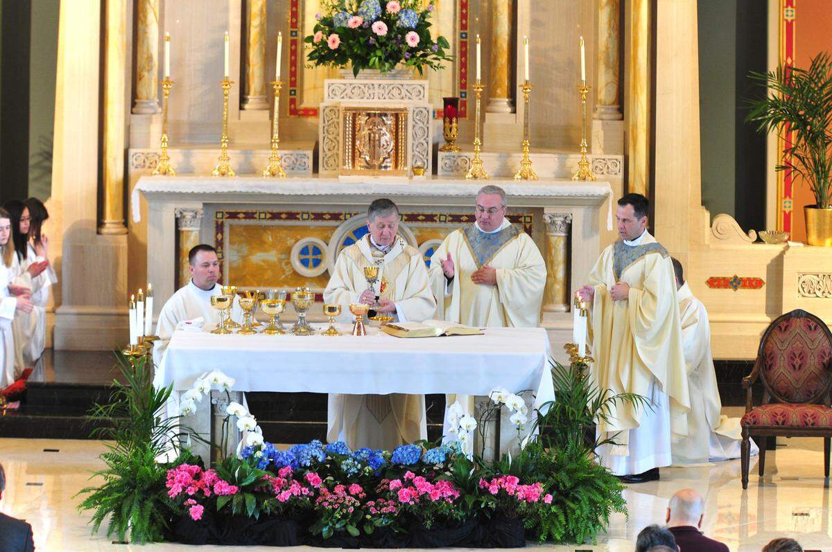 The Rev. Michael G. McGovern, second from right, is shown at a Mass with Archdiocese of Chicago Cardinal Blase J. Cupich, second from left.