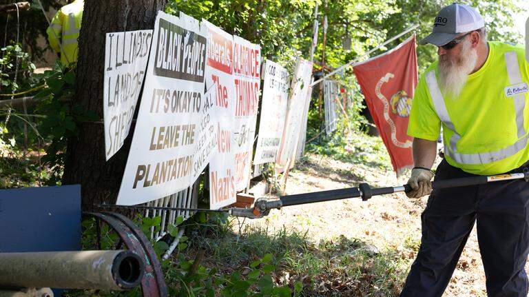 Belleville removes resident’s overgrown weeds, leaves political signs