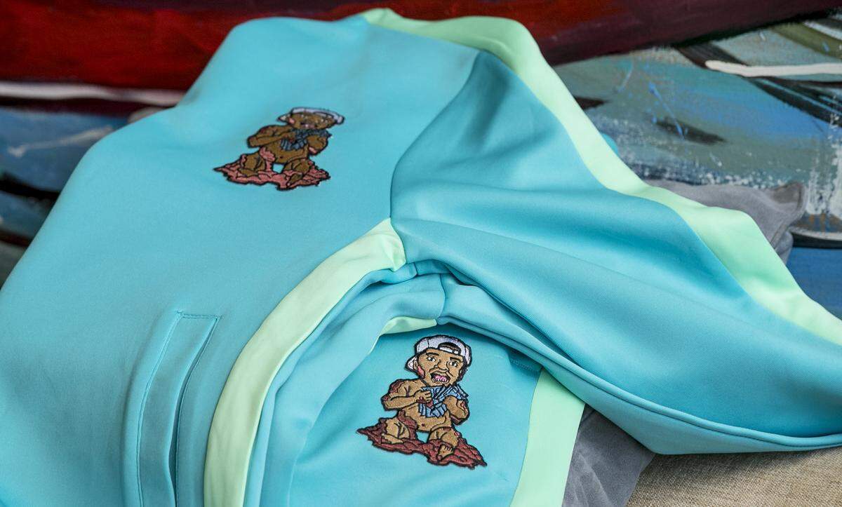Fashion designer Arion Gilkey’s signature Mudd Brothers logo on a track suit.