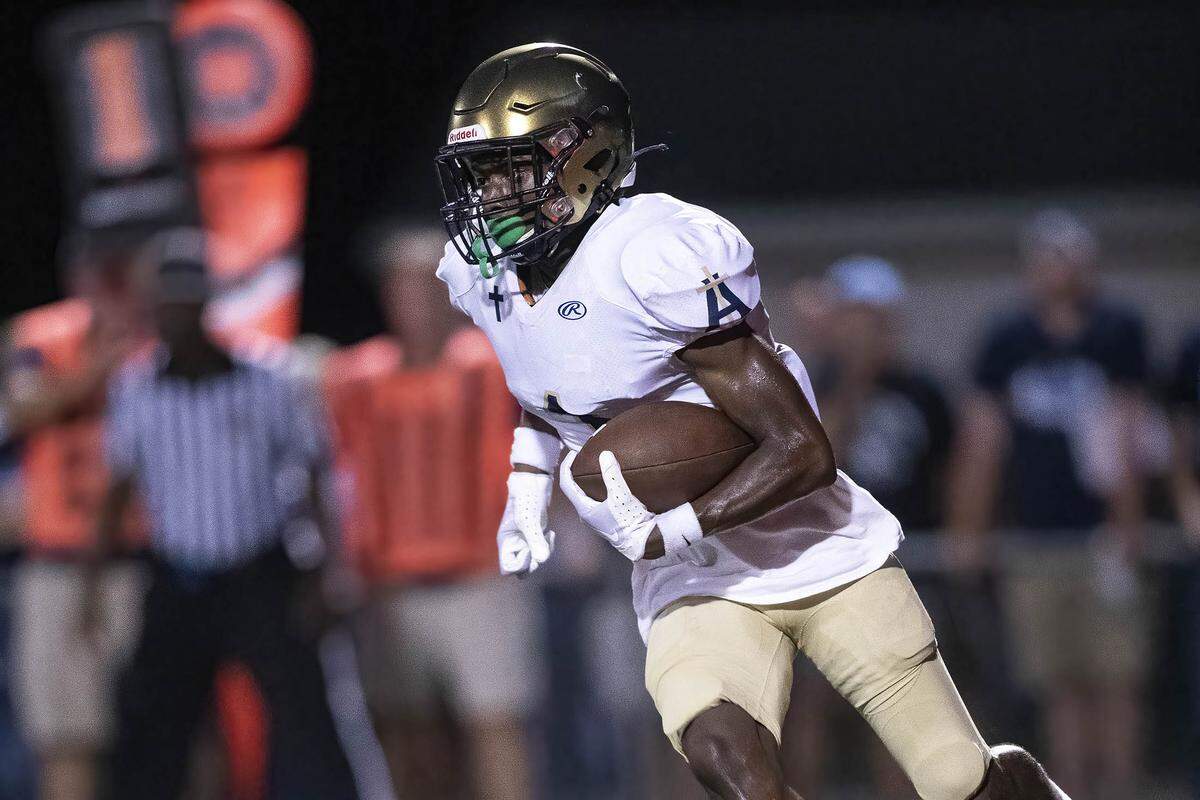 Althoff’s Charleston Coldon carries the ball during Friday night’s game against Mater Dei. The Crusaders went on to post a 13-7 non-conference victory.
