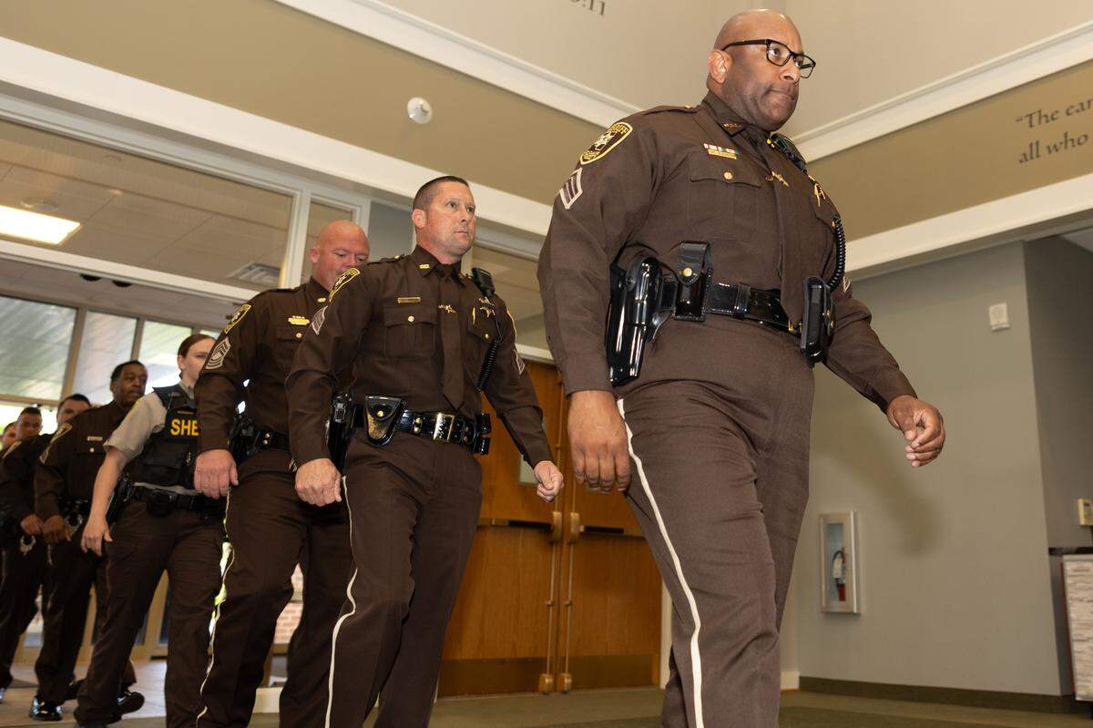 Officers from St. Clair County lead a procession of police officers at the start of a memorial service for fallen police officers of St. Clair County in Christ Church on Frank Scott Parkway in Fairview Heights, Ill. on May 7, 2024.