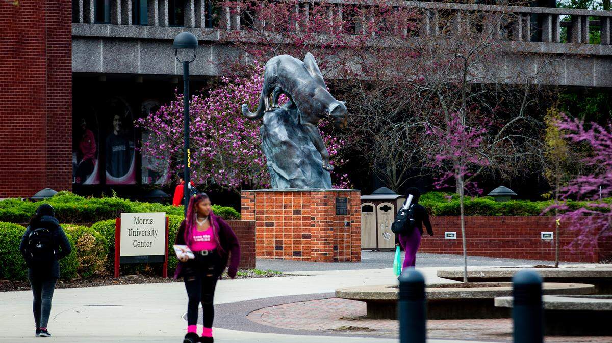 Students walk past Southern Illinois University Edwardsville’s Morris University Center on the campus in Edwardsville.