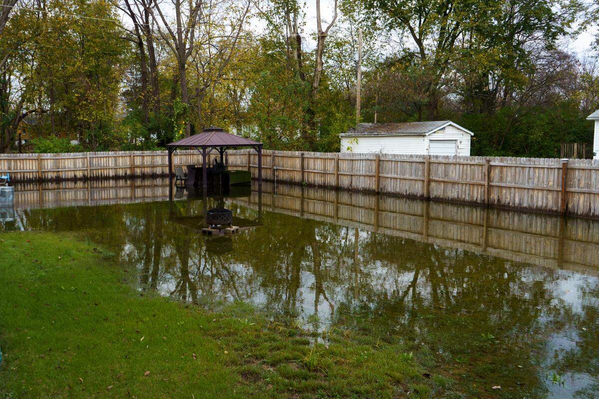 Terry Barnes backyard is flooded on Belmont Ave in East St. Louis, IL on Wednesday, Nov. 6, 2024.
