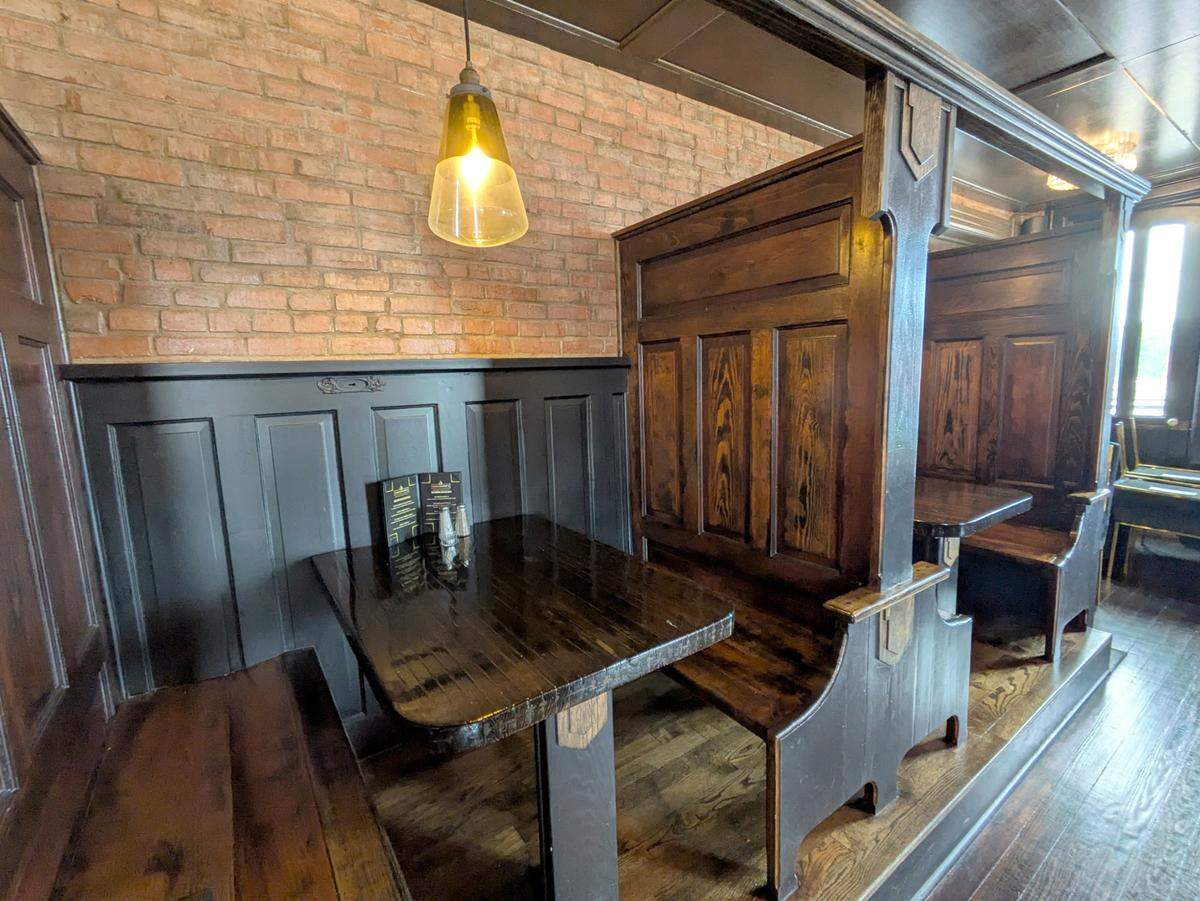 Booth seating areas on the second floor of Gallagher’s were partially made with repurposed doors, salvaged from the building’s renovation.