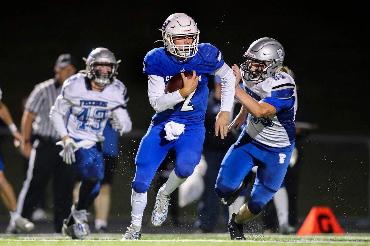 Columbia’s Dominic Voegele (12) carries the ball for a touchdown during the second quarter of a Cahokia Conference game against Freeburg this fall. Voegele, who had an excellent season on the gridiron, also is a star pitcher and will continue his baseball career at Kansas University.